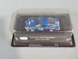 a small blue car in a plastic container on a table