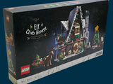 une boîte contenant une maison de Noël en Lego