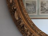 a mirror that is hanging on the wall in the room