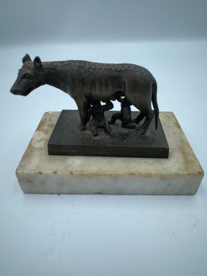 statue of a donkey and a calf on a marble base