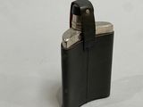 a black leather case with a lighter inside of it