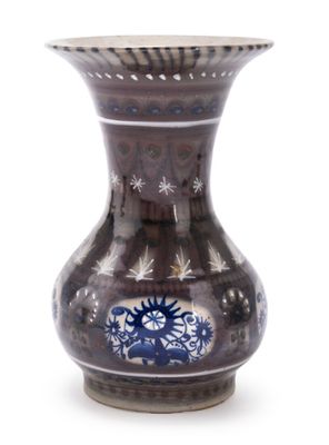 a vase that has a blue and white design on it