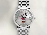 a close up of a watch with a mickey mouse face on it