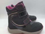 the children ' s boots are black and pink with a pink lining