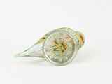 a glass vase with a colorful flower inside of it