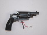 a close up of a revolver on a white surface