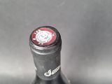 a close up of a bottle of beer on a table