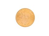 a close up of a gold coin on a white background