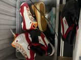 many pairs of shoes that are in a container