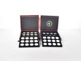 a pair of silver and gold coins in a black case