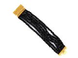 a close up of a black beaded bracelet on a white background