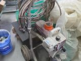a machine that is sitting on the floor next to a pile of trash