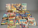 a pile of comic books sitting on top of a table