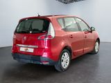 a picture of a red car parked in a garage