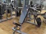 a gym with a lot of machines in the room