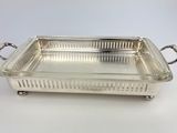 an antique silver plated serving dish with handles and handles