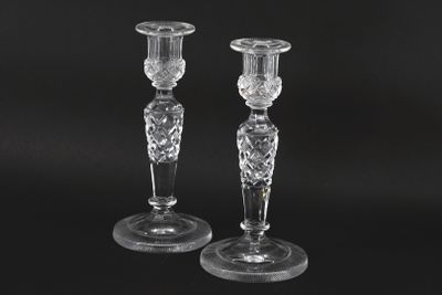 pair of crystal candlesticks on a black background
