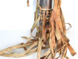 a very old wooden object that is sitting on a table