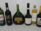 many bottles of wine lined up on a table