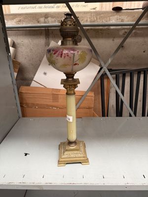 a lamp that is sitting on a shelf in a room