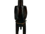 an old wooden statue of a man with a hat on his head