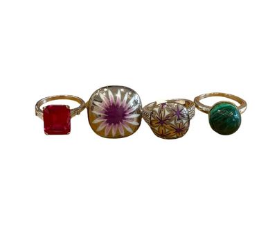 three rings and a ring with a flower on it