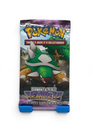 a close up of a box of pokemon trading cards on a white background
