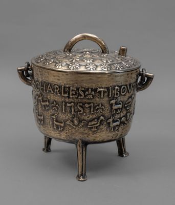 an antique silverware pot with a handle and handles on a stand