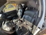 the interior of a car with black leather seats and a steering wheel