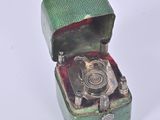 a small green box with a camera inside of it