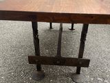 an image of a wooden table with metal legs