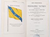 an open book with a yellow and blue flag on it