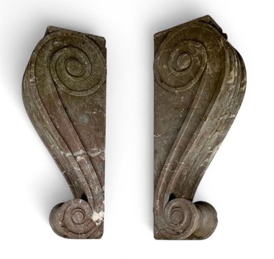 pair of carved wood corbs with spiral designs on each side
