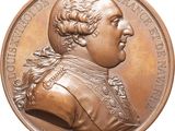 an image of a bronze medal with a portrait of a man on it