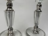 two candles that are sitting on a table