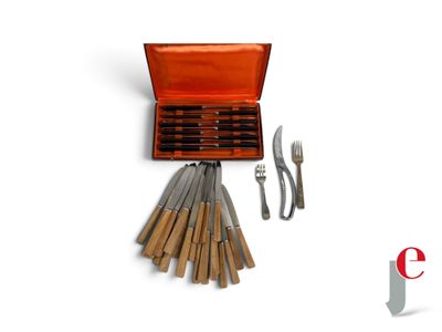 knives, forks, and spoons are arranged in a wooden box
