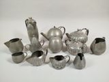 a lot of silver items that are on the table