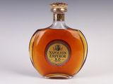 an image of a bottle of brandy sitting on top of a table