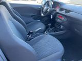 a car that is sitting in a parking lot with its front seats down