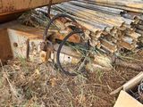 a pile of wood sitting next to a pile of metal