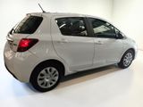 a picture of a white car parked in a showroom