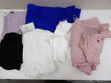 four pairs of underwear are laid out on a white table