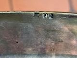 a silver plate with numbers on it sitting on a table