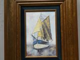 tableau représentant un voilier à la voile jaune, dans un cadre en bois