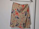a skirt hanging on a hanger in a room