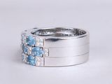 an image of a ring with blue and white diamonds