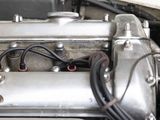 a close up of a car ' s engine with wires attached