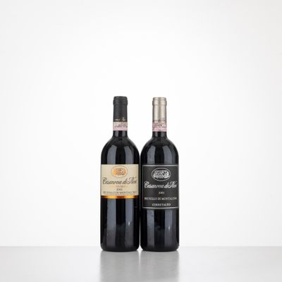 two bottles of wine sitting on top of a table next to each other
