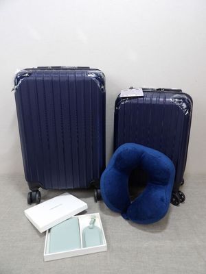 two pieces of luggage sitting next to each other