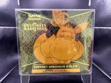 a close up of a pokemon trading card on a display case